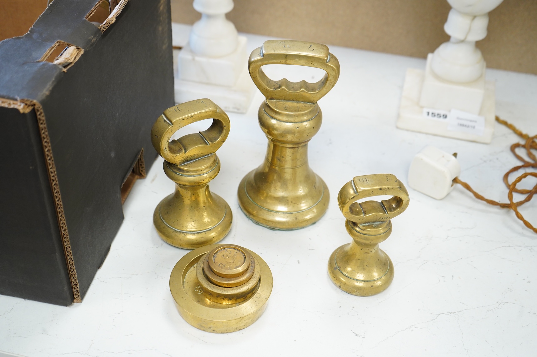 Two leather-cased spirit flasks and graduated set of brass weights